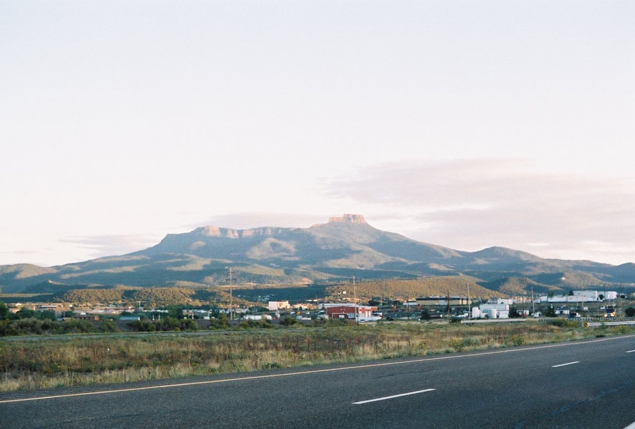 Fishers Peak can be seen from the highway as clouds haze around the mountain.